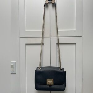 Michael Kors black matte leather handbag with gold accents